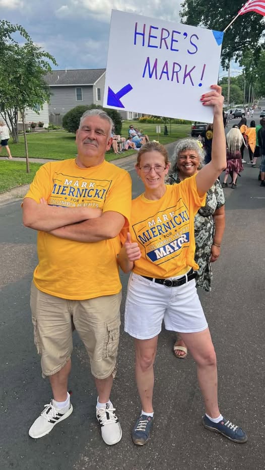 Campaign supporters wearing yellow Mark Miernicki shirts at an outdoor event